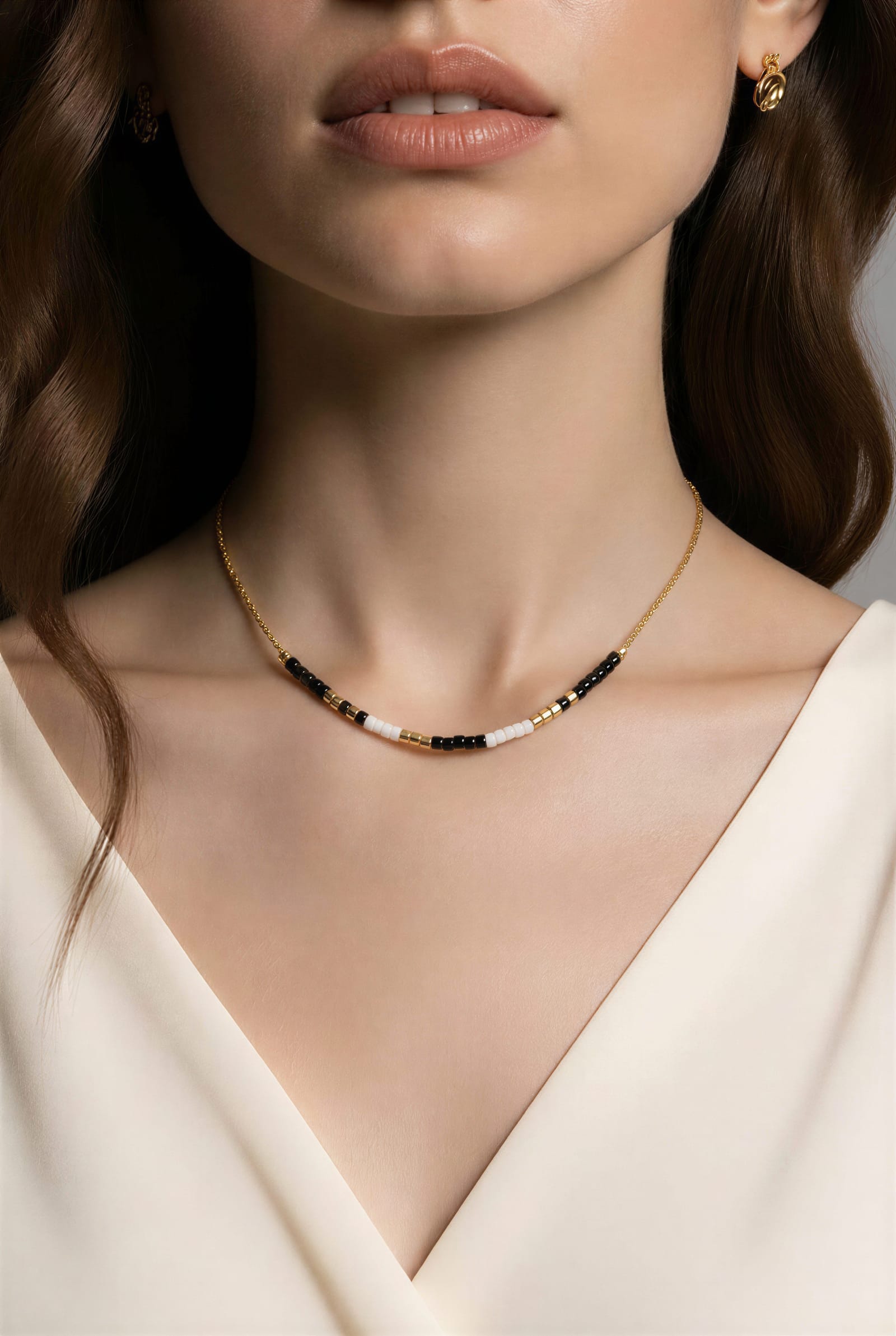 Miyuki beads, sitting right at the collarbone.